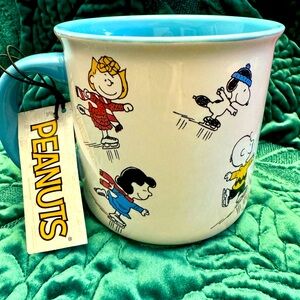 Peanuts Snoopy characters mug with ice skating design 20oz